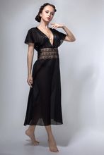 A  nightgown of semi-fitting silhouette  with one-piece sleeve. 100% black cotton