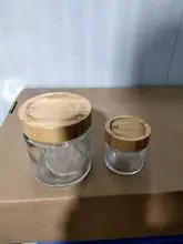 Frasco de vidro transparente de 2 onças e 9 onças com tampa de bambu espiral lisa e logotipo graduado a laser