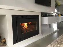 Built-in double combustion wood heater for recessed/heater/fireplace closed