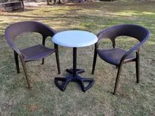 Round Table with Ratten stacking chairs 