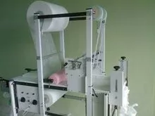 motorized diaper machine with anti leakage barrier