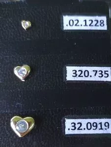 Trio of hearts earrings with zirconias clad in 18k gold